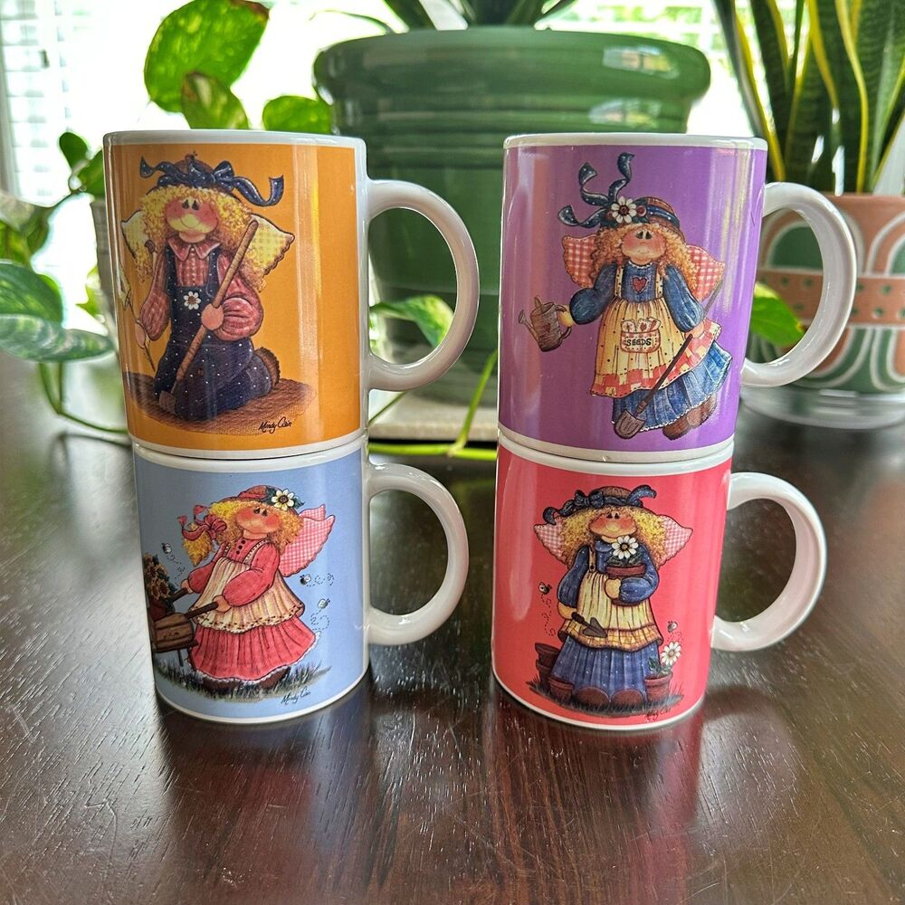 Mindy Cain 10 oz Mug (Set of 4) Designpac Farm Gardening Angels Collection